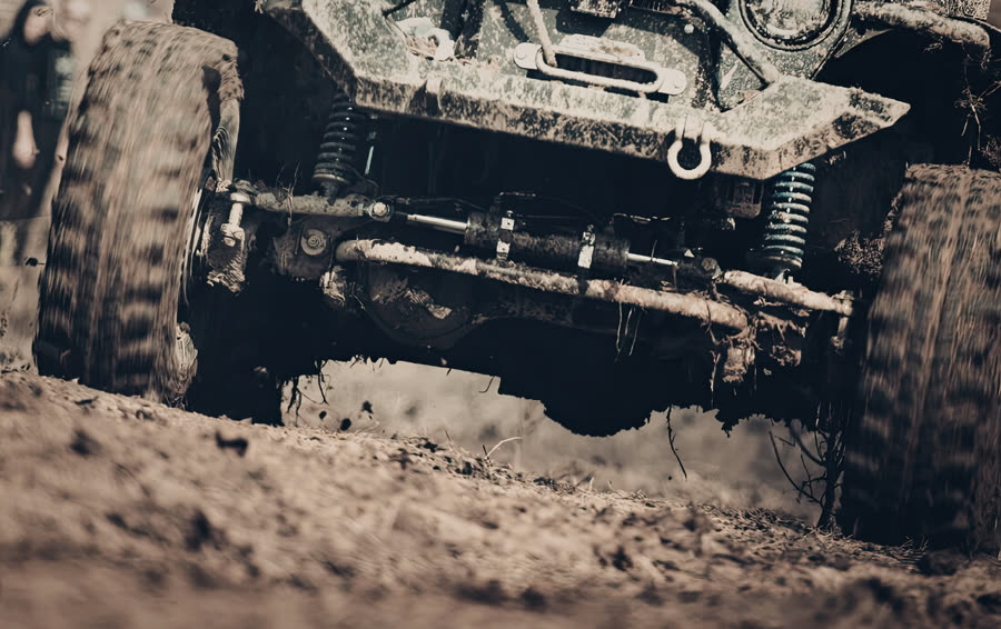 Shocks, struts and suspension components inspected on a lifted vehicle in Colorado Springs